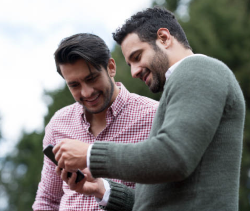 Salesperson showing the Sensar Marine app to a boat buyer
